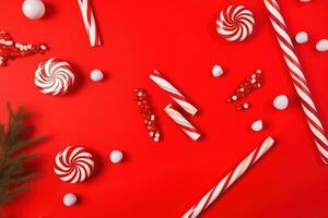 ai généré Noël bonbons cannes et bonbons sur rouge Contexte photo