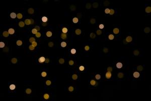 défocalisé abstrait d'or Jaune circulaire flou bokeh lumières pour une de fête Contexte. photo