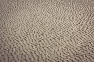 proche en haut de mer plage le sable ou désert le sable pour texture et Contexte photo