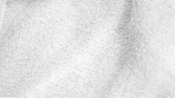 fond de texture de laine propre blanche. laine de mouton naturelle légère. coton blanc sans couture. texture de fourrure moelleuse pour les concepteurs. tapis en laine blanc fragment gros plan... photo