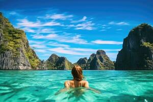 ai généré Jeune femme dans luxe maillot de bain relaxant dans tropical lagune, Ha longue baie, vietnam, Jeune femme nager dans clair mer l'eau dans lagune et à la recherche à magnifique paysage. en voyageant, ai photo