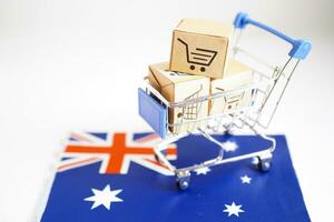 achats en ligne, panier d'achat sur le drapeau australien, import export, finance commerce. photo