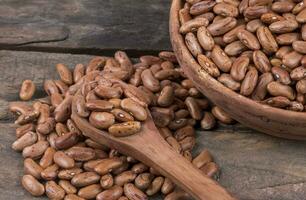 rouge un rein des haricots sur en bois Contexte photo