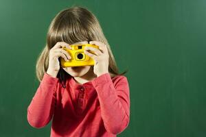 peu fille avec photo caméra