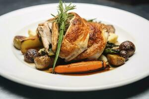 ai généré plaqué poulet rôti dîner sur une blanc assiette avec carotte et morille champignon. ai généré. photo