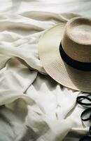 ai généré une paille chapeau, des lunettes de soleil et une paille seau chapeau mensonge sur une blanc couverture, photo
