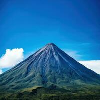 ai généré le inspirante Puissance et beauté de une imposant volcan ensemble contre une clair bleu ciel. photo