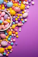 ai généré une amusement et de fête Pâques scène avec œufs, bonbons, et décorations sur une brillant violet. photo
