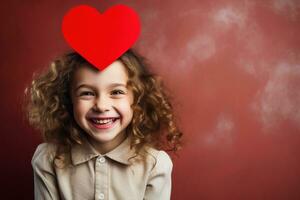 ai généré portrait de une mignonne peu fille avec rouge cœur sur valentines journée concept. photo