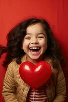 ai généré portrait de une mignonne peu fille avec rouge cœur sur valentines journée concept. photo