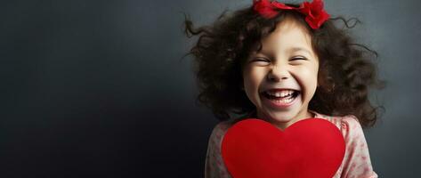 ai généré portrait de une mignonne peu fille avec rouge cœur sur valentines journée concept. photo