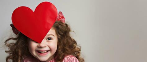 ai généré portrait de une mignonne peu fille avec rouge cœur sur valentines journée concept. photo