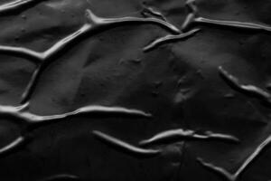 fond de texture d'affiche en plastique froissé et froissé noir photo