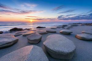 ai généré magnifique rochers sur le plage à le coucher du soleil. pro photo