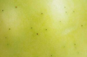 macro texture de Pomme peler. vert Pomme comme une Contexte. photo