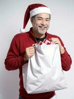 ai généré une homme Père Noël claus en portant une cadeau sac sur blanc Contexte ai généré photo
