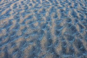 une proche en haut de une Jaune le sable surface photo