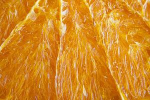 Orange frites texture, macro. fruit puces. une en bonne santé collation. photo