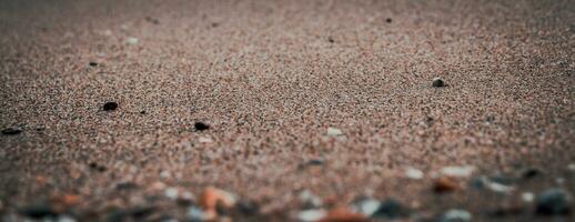 proche en haut le sable plage Contexte concept photo. coloré petit mer des pierres sur le plage. photo