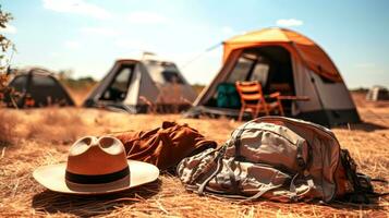 ai généré camping équipement sur champ, fermer. camping voyage concept photo