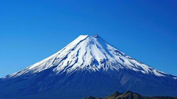 ai généré le inspirante Puissance et beauté de une imposant volcan ensemble contre une clair bleu ciel. photo