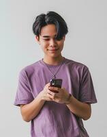 ai généré portrait de une Jeune asiatique homme en utilisant mobile téléphone sur blanc Contexte photo