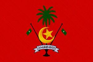 drapeau et manteau de bras de république de Maldives sur une texturé Contexte. concept collage. photo