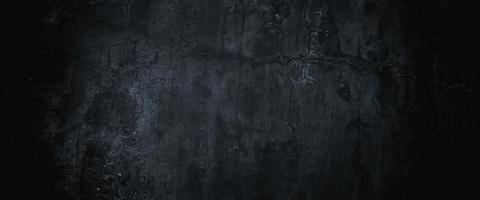 murs sombres effrayants, texture de ciment en béton noir légèrement clair pour le fond photo