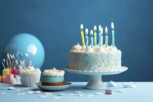 ai généré anniversaire gâteau avec bougies et bonbons sur blanc table près bleu mur. génératif ai photo