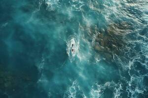 ai généré aérien vue de le la vitesse minuscule bateau dans clair bleu l'eau à le coucher du soleil . Haut vue de drone de dans mer photo