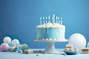 ai généré anniversaire gâteau avec bougies et bonbons sur blanc table près bleu mur. génératif ai photo