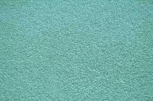 turquoise horizontal mur couvert avec plâtre texture. photo