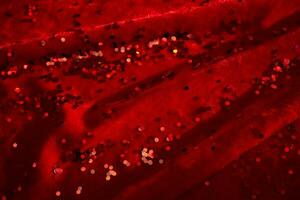 abstrait Noël Contexte fabriqué de rouge velours en tissu avec rouge scintille. photo