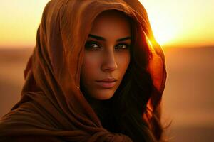ai généré portrait de une Jeune musulman femme dans une hijab dans le désert contre le coucher de soleil, arabe femmes visage contre le le coucher du soleil ai généré photo