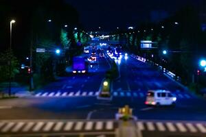 une nuit miniature circulation confiture à le centre ville rue dans tokyo photo