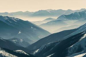 ai généré Stupéfiant vue de neigeux montagnes, paisible vallées avec une toucher de brouillard valoriser le tranquille paysage photo