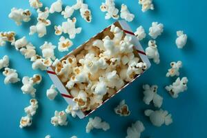 ai généré bleu délice pop corn arrangé astucieusement contre une vibrant bleu Contexte photo