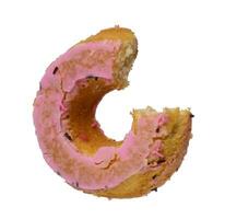 une mordu rond Donut versé avec rose glaçage sur un isolé Contexte photo
