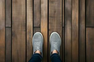 ai généré chaussure capture, Haut vue selfie sur une en bois sol Contexte photo