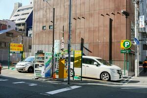 Osaka ville, Japon, 2019 - pièce de monnaie parking lot prestations de service sont très populaire dans Japon. car le Japon loi permet citoyens à avoir voitures, avoir besoin à avoir espace pour leur posséder parking. photo