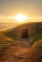 ai généré lever du soleil plus de une mégalithique tombeau photo