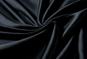 une noir satin en tissu avec une foncé bleu Contexte photo