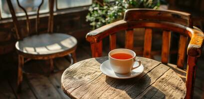 ai généré une tasse de thé est assis sur le table suivant à autre objets photo