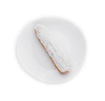 éclair dans blanc glaçage et noix de coco flocons photo