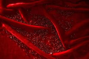 abstrait Contexte de rouge perles sur rouge velours. photo
