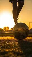 ai génératif silhouette de une football joueur sur une Football champ à le coucher du soleil sportif homme est dribble avec le Balle Extérieur photo