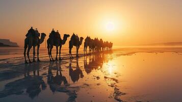 ai généré caravane de chameaux sur le sel Lac à lever du soleil. photo