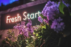 ai généré Frais début signe avec une bouquet de violet fleurs dans le Contexte. photo