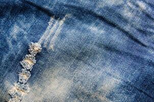 les rides bleu jeans texture. jeans Contexte. photo