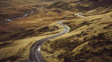 ai généré photo de route traversant par robuste et clairsemé paysage. le route devrait être étroit et non pavé, serpentant ses façon montée au milieu de le brunâtre vert terrain ai généré